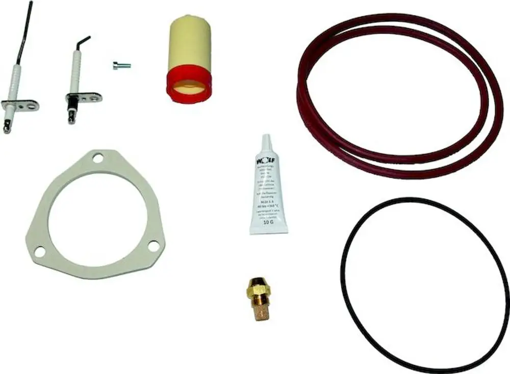 Wartungsset bestehend aus verschiedenen Bauteilen wie Dichtungen, Schläuchen, Ultraschallreiniger und Montagezubehör der Marke Wolf.